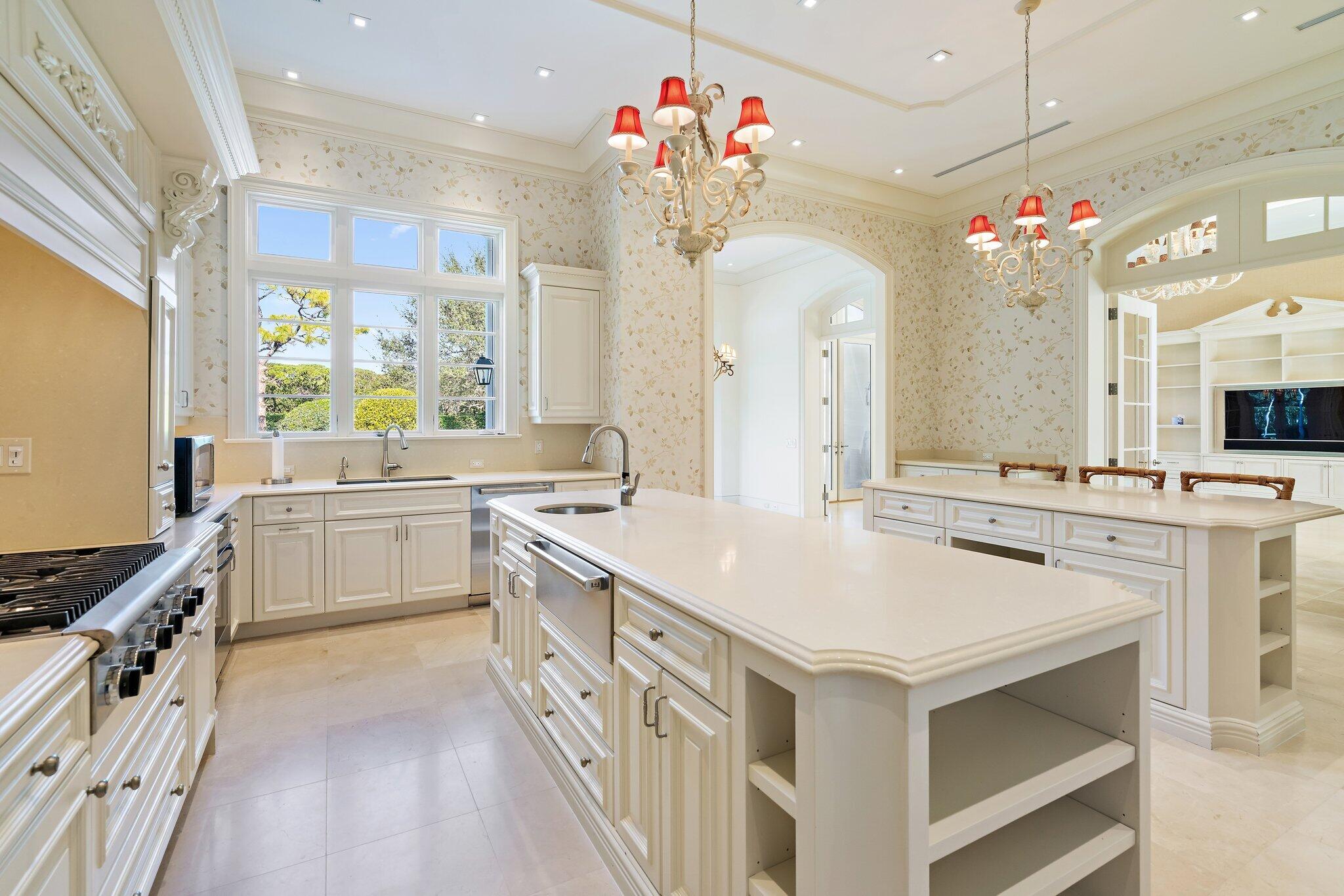 124 Bears Club Drive Jupiter, FL 33477 - Photo 52 of 75 a kitchen with a sink stove and cabinets