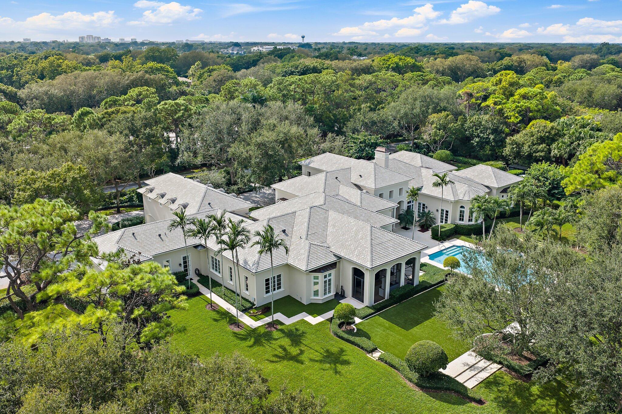 124 Bears Club Drive Jupiter, FL 33477 - Photo 6 of 22 an aerial view of a house with a garden