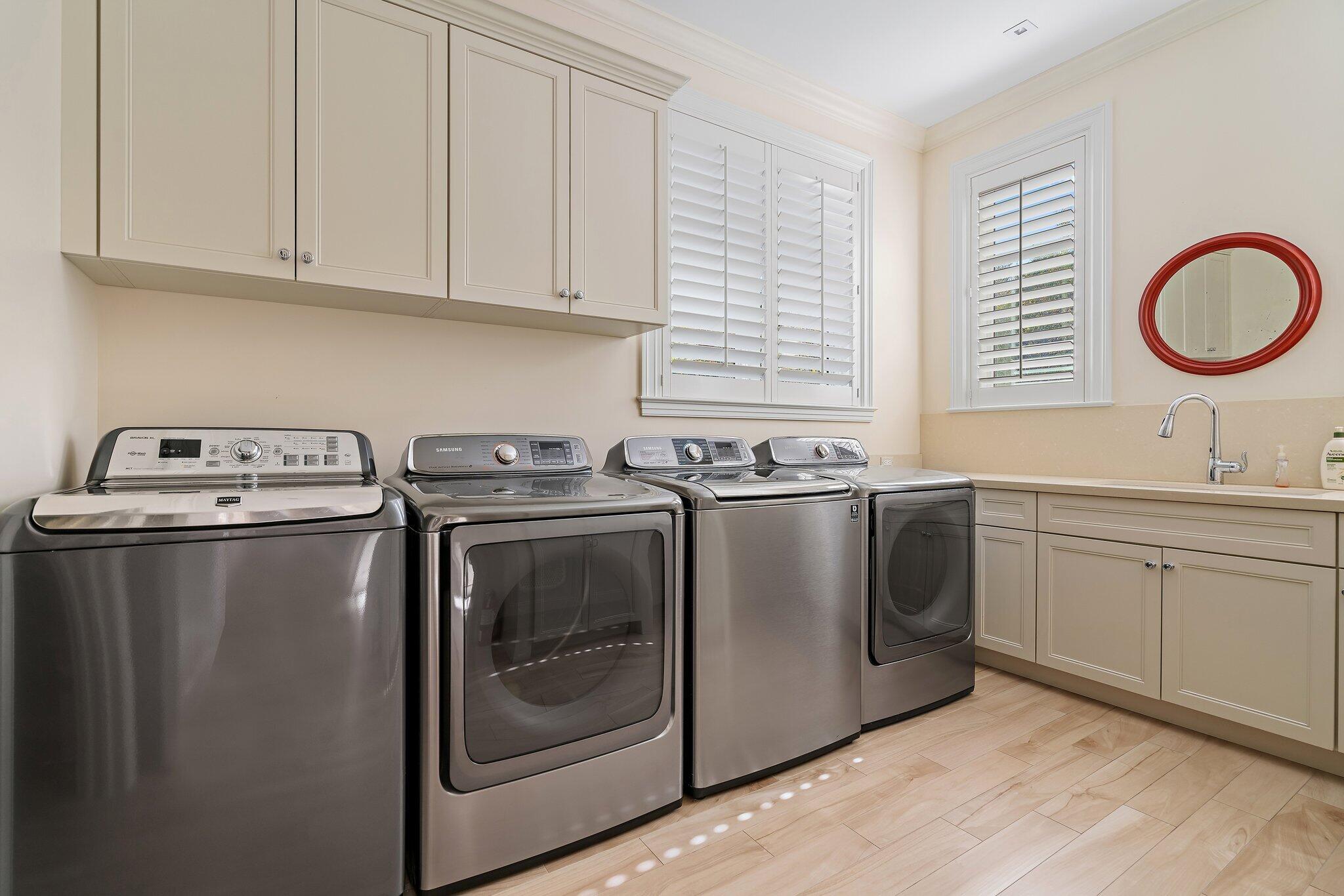 124 Bears Club Drive Jupiter, FL 33477 - Photo 69 of 75 a utility room with sink dryer and washer