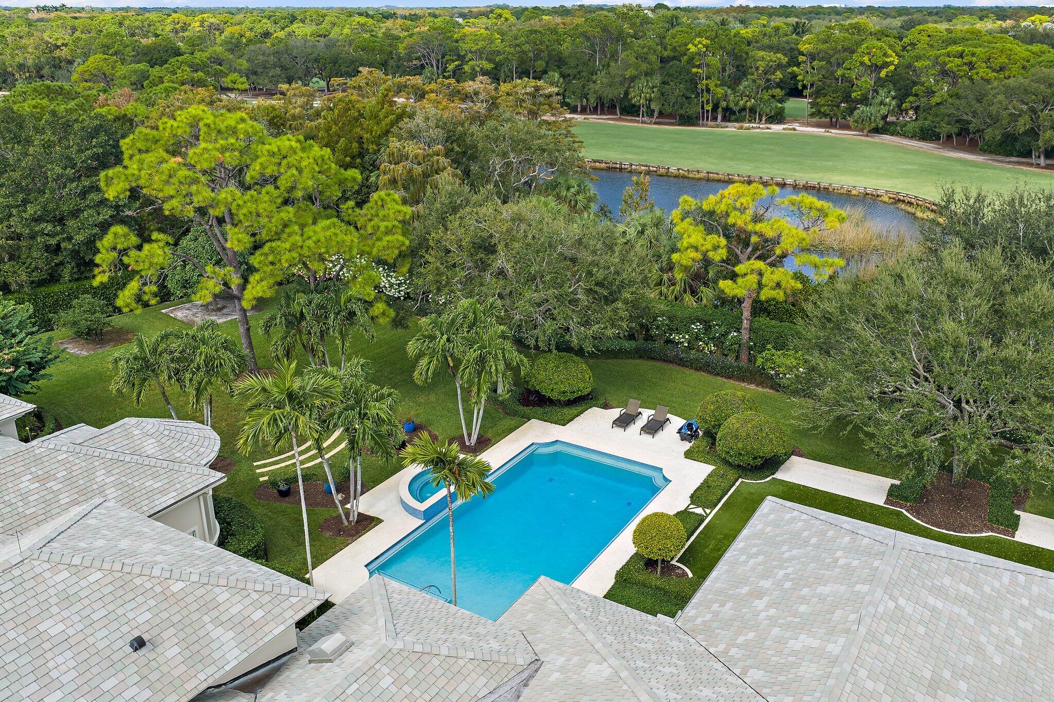 124 Bears Club Drive Jupiter, FL 33477 - Photo 10 of 22 an aerial view of a house with a yard