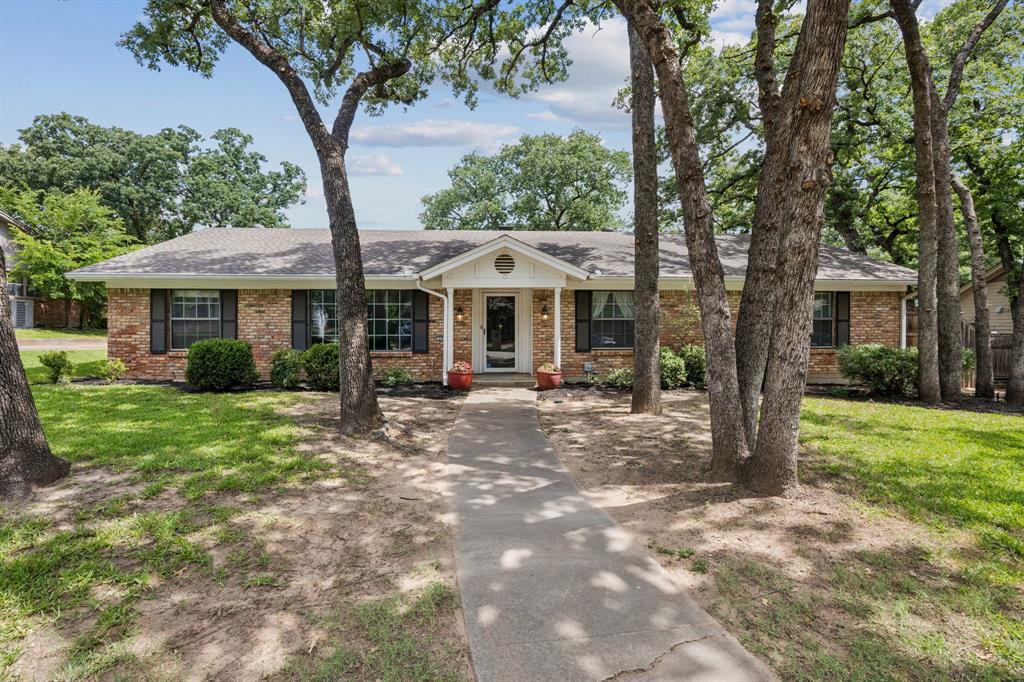 204 Shelmar Drive Euless, TX 76039 - Photo 1 of 1 Ranch-style home featuring brick siding, a front yard, and roof with shingles