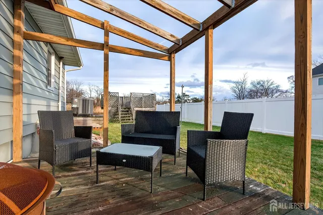 an aerial view of a house with swimming pool and ocean view