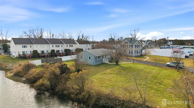 an aerial view of a house with a swimming pool