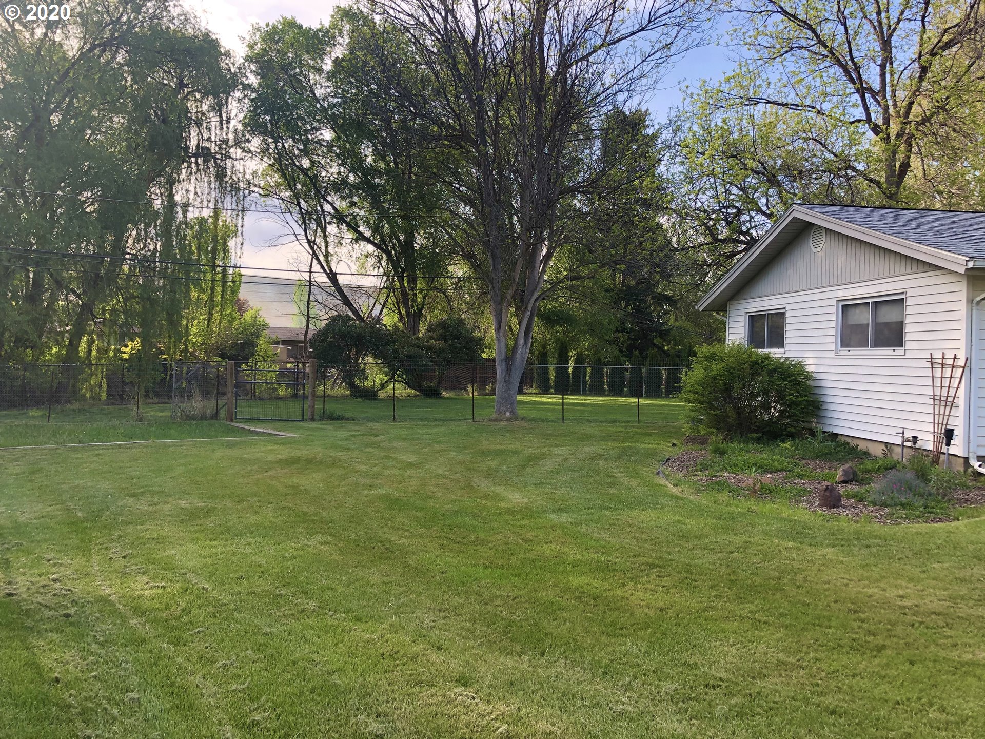 4142 Southwest Perkins Court Pendleton, OR 97801 - Photo 4 of 25 a view of a house with a backyard