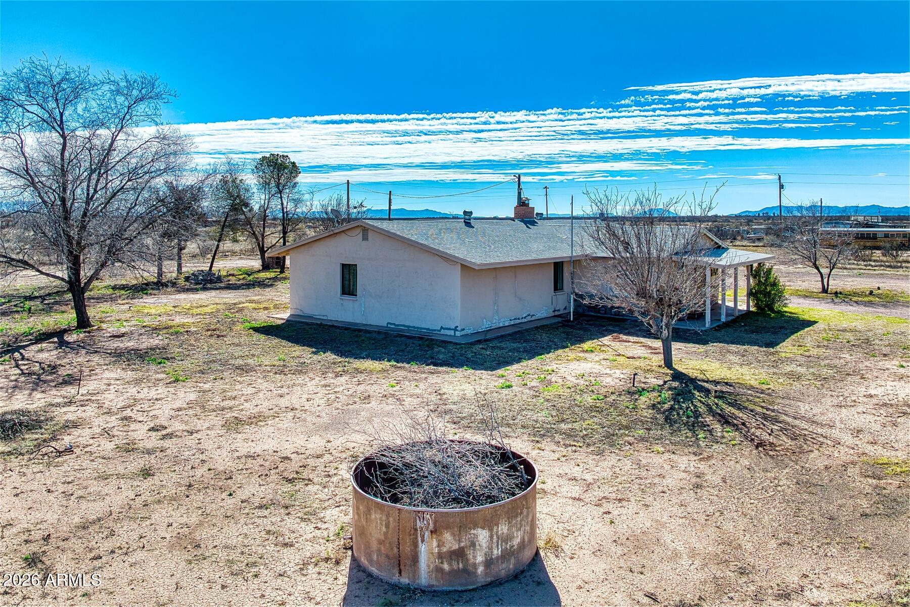 7027 North Bond Road McNeal, AZ 85617 - Photo 14 of 20 a room with a table and a chair