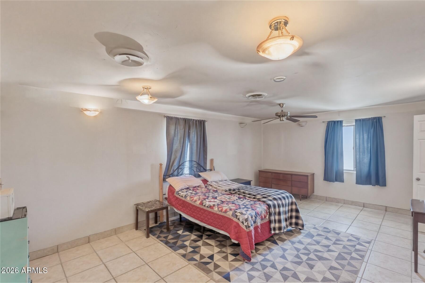 7027 North Bond Road McNeal, AZ 85617 - Photo 15 of 20 a bedroom with a bed and cabinets