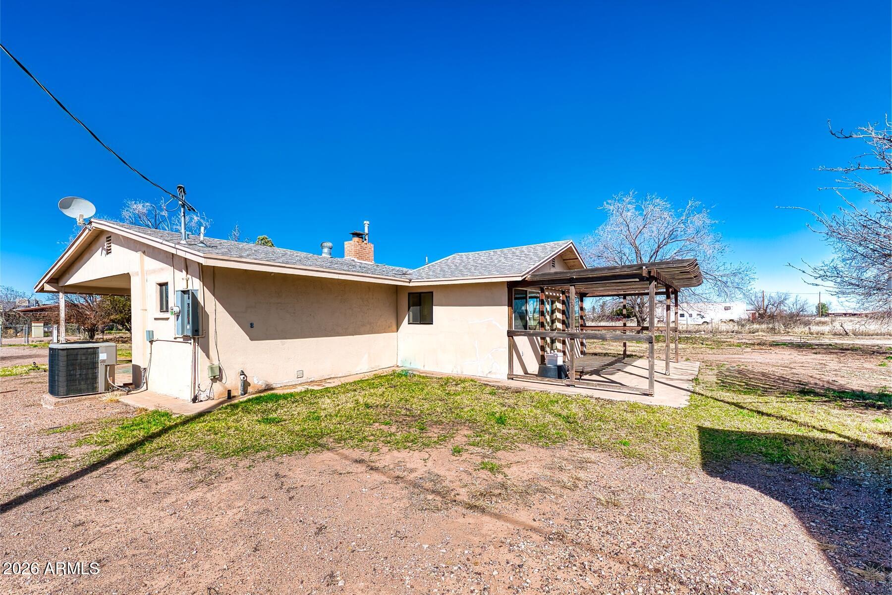 7027 North Bond Road McNeal, AZ 85617 - Photo 18 of 20 a view of a house with a yard