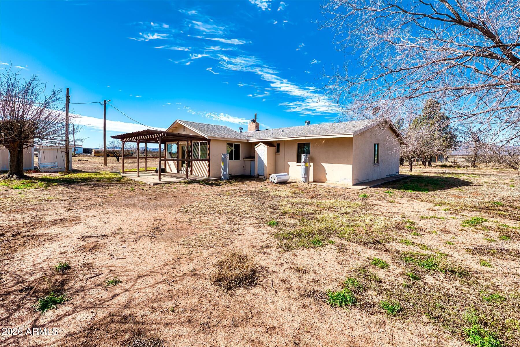 7027 North Bond Road McNeal, AZ 85617 - Photo 19 of 20 a view of a house with a yard
