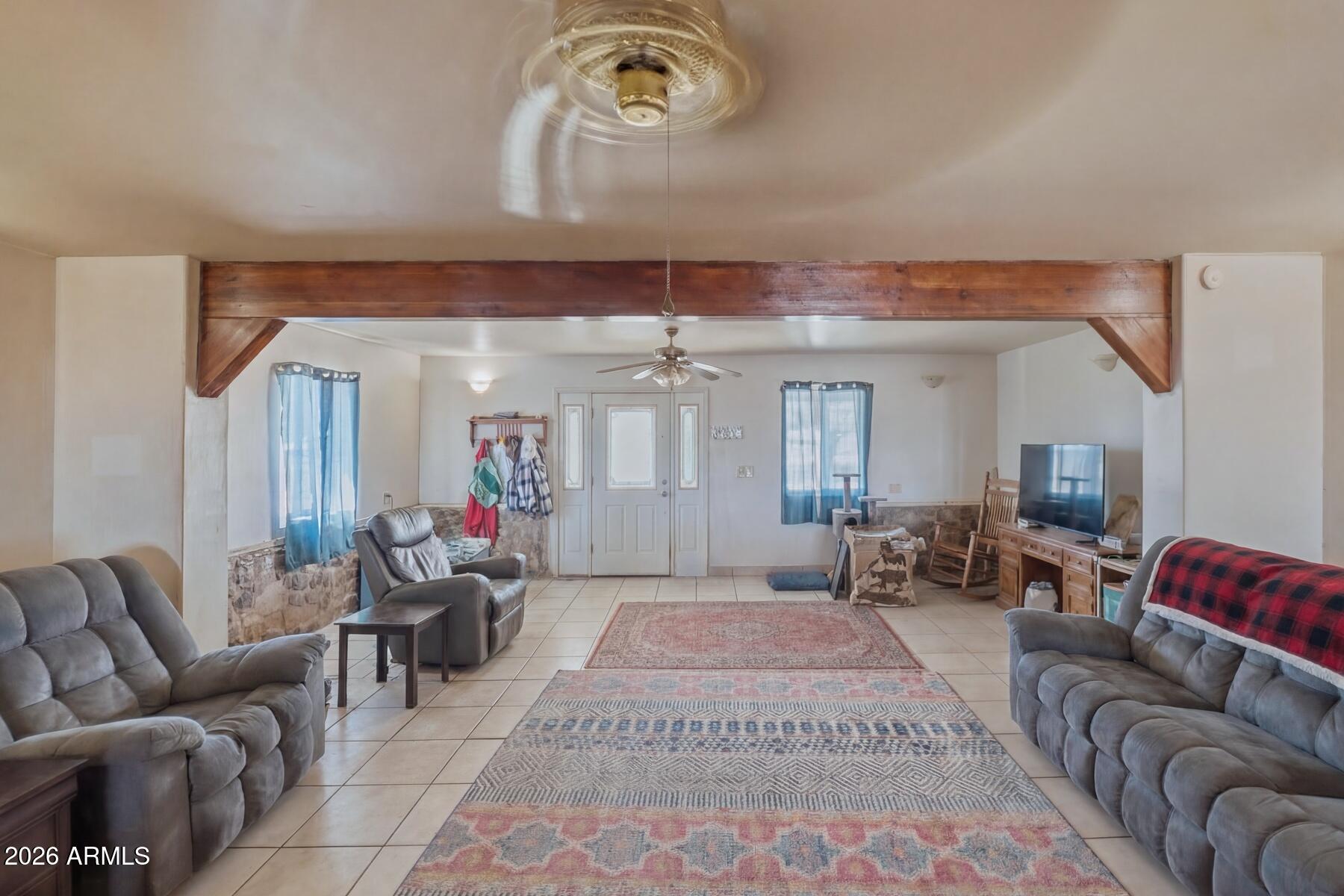 7027 North Bond Road McNeal, AZ 85617 - Photo 4 of 20 a living room with furniture and a chandelier