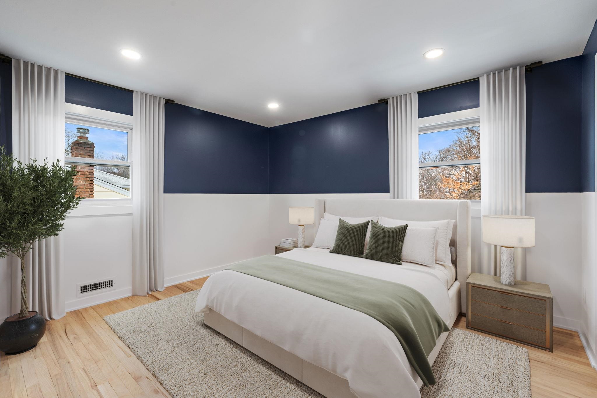 125 Rutgers Place Clifton, NJ 07013 - Photo 19 of 36 a bedroom with a large bed and potted plant with wooden floor