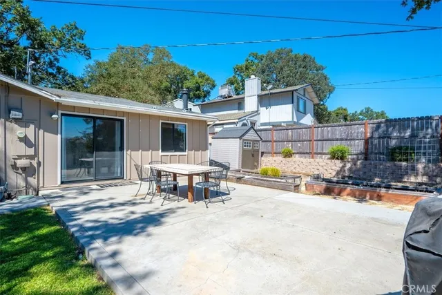 a view of a house with a yard patio and swimming pool