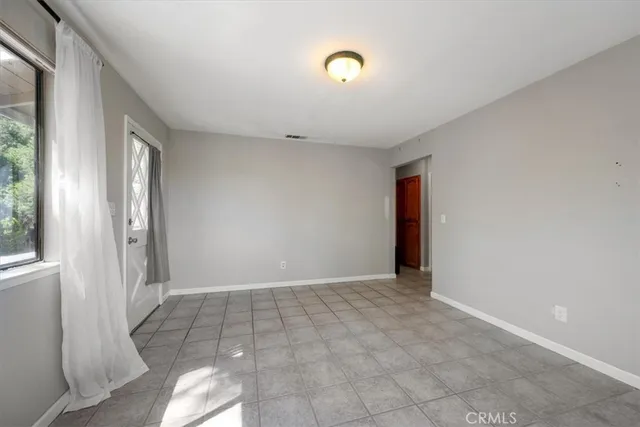 a kitchen with stainless steel appliances a sink stove and cabinets