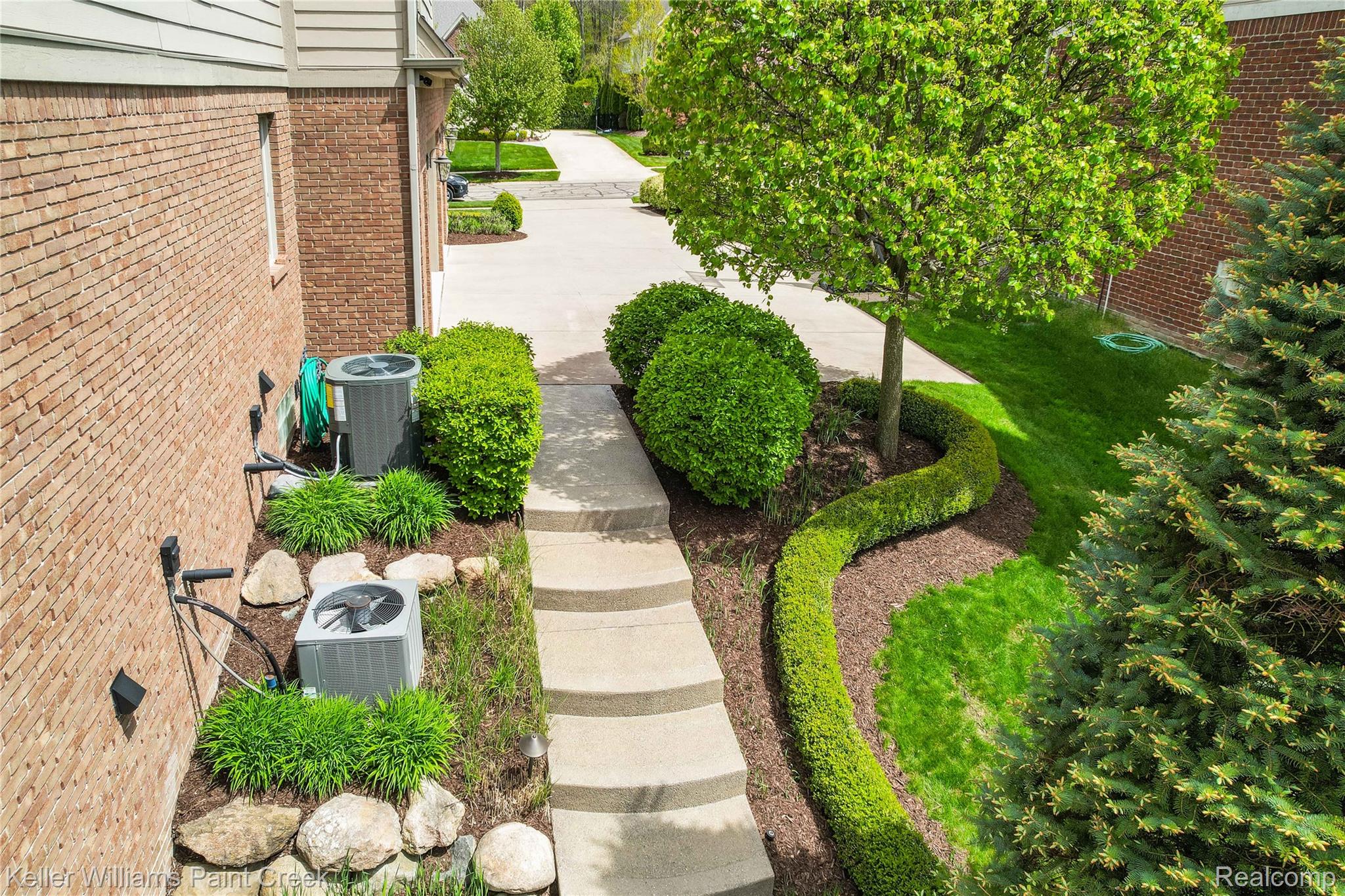 2757 North Addison Circle Rochester, MI 48306 - Photo 4 of 67 Exposed aggregate stairs leading down to gunite saltwater pool & yard