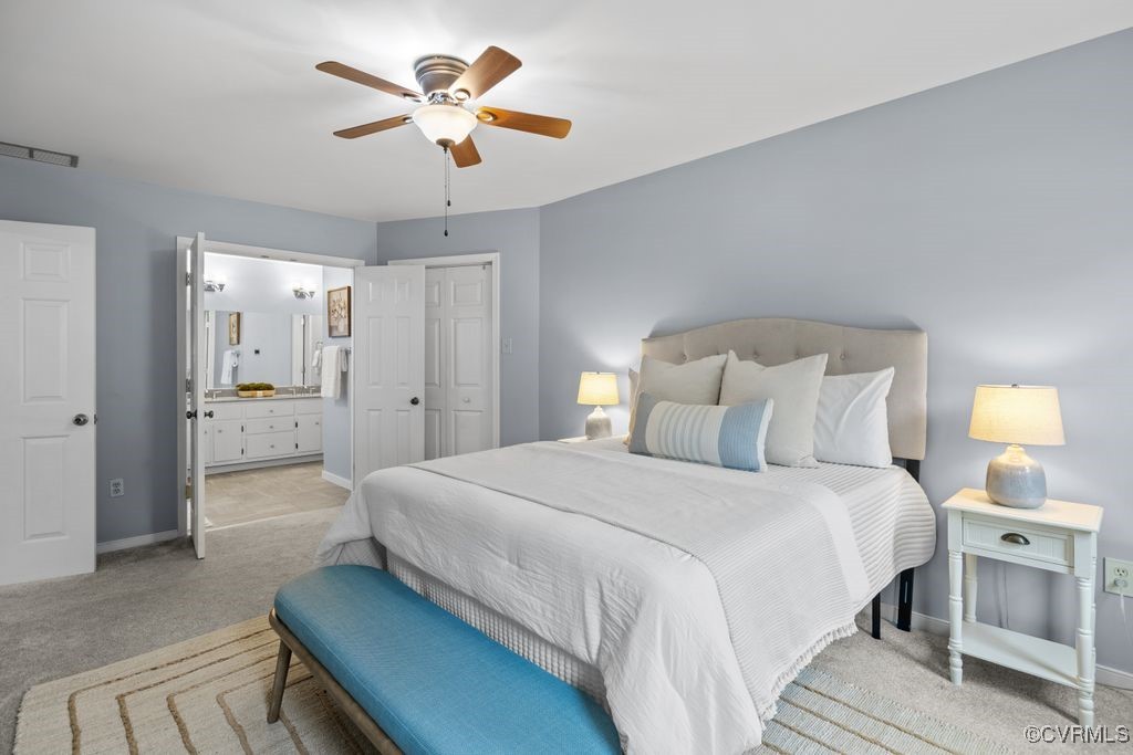 717 Shadowhill Court Midlothian, VA 23114 - Photo 19 of 44 a spacious bedroom with a bed and a chandelier