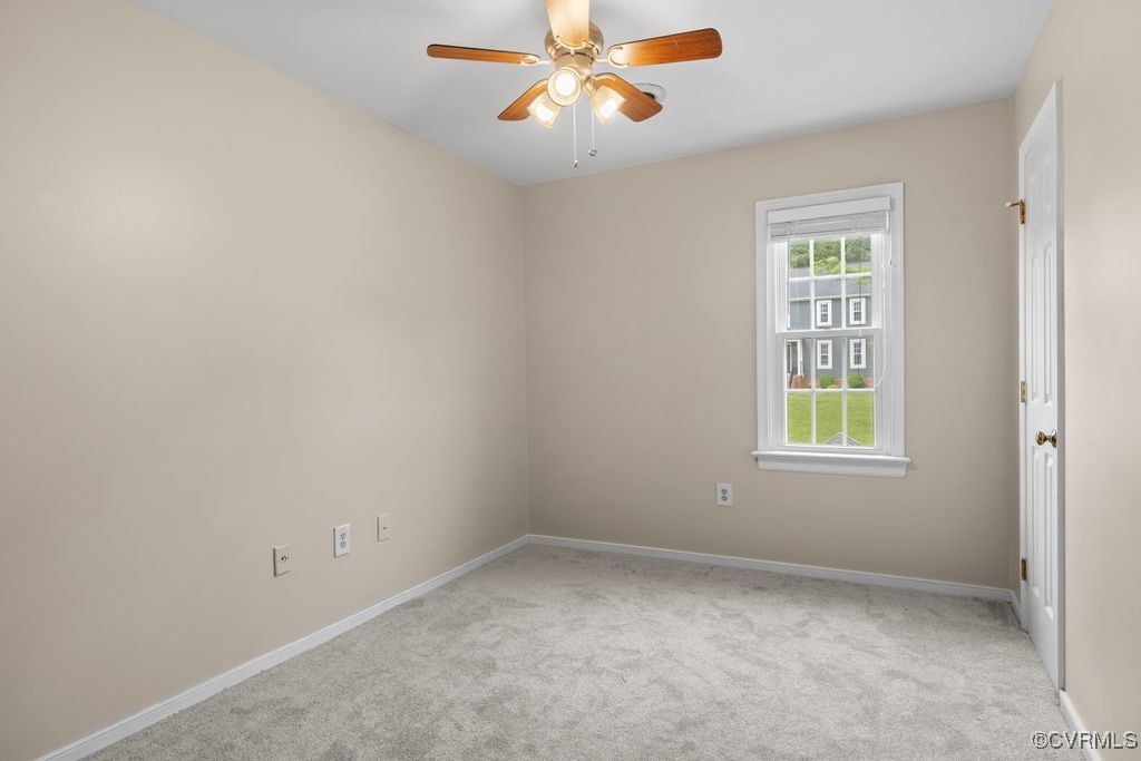 717 Shadowhill Court Midlothian, VA 23114 - Photo 23 of 44 an empty room with a window and a fan
