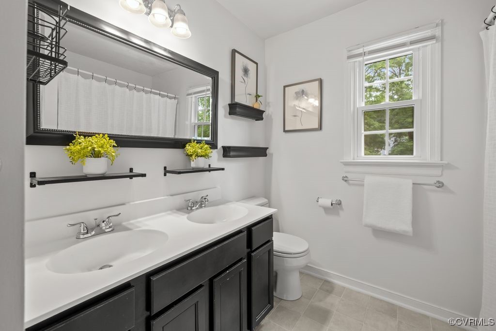 717 Shadowhill Court Midlothian, VA 23114 - Photo 24 of 44 a bathroom with a sink toilet and a mirror