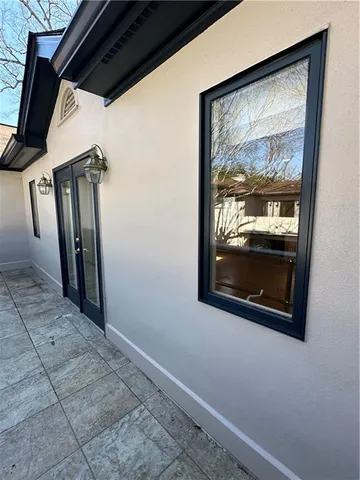 a view of a hallway with wooden floor and a fireplace