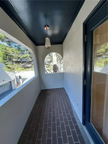 a view of a room with wooden floor