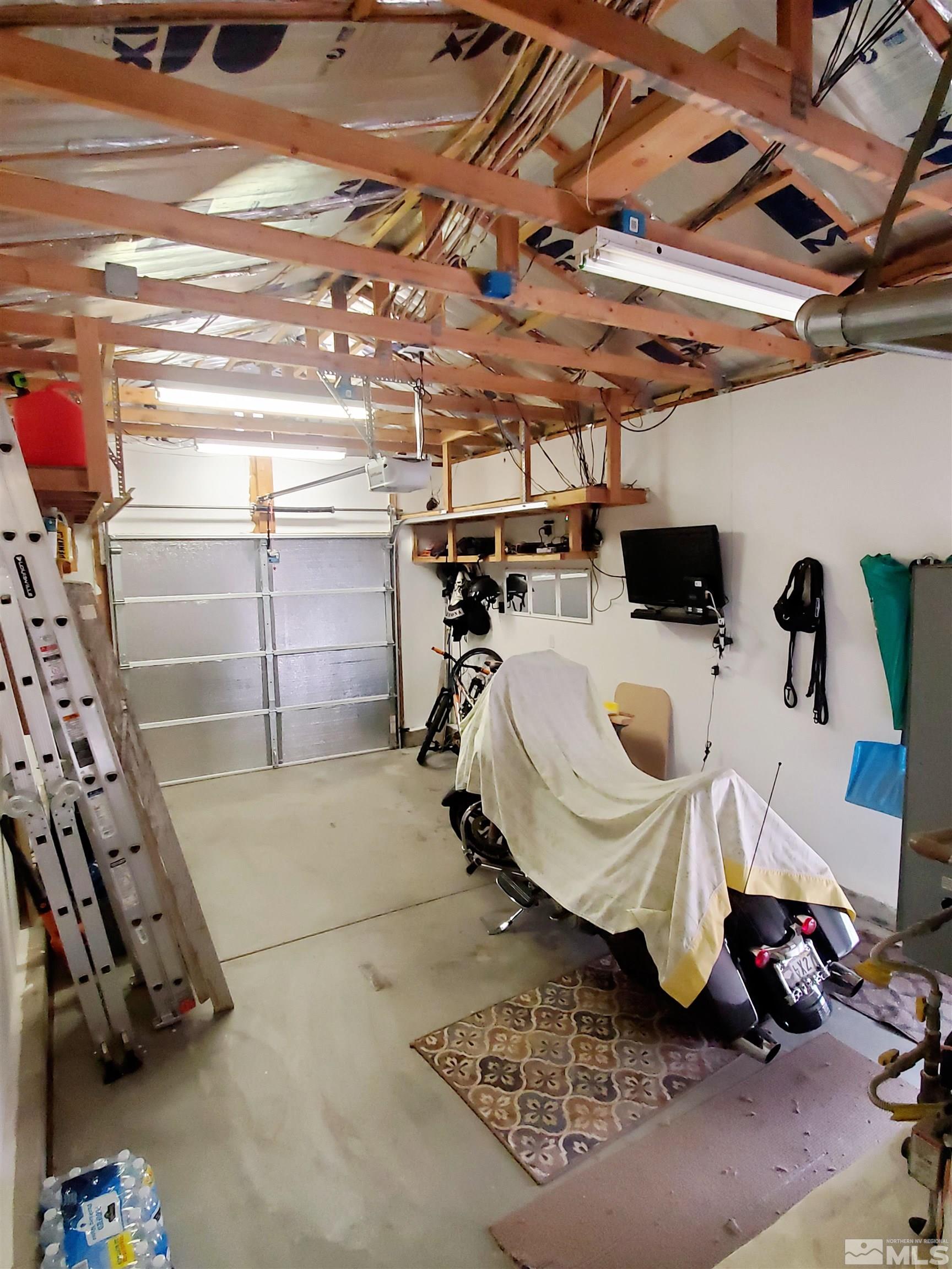 13590 Mt Olympus Street Reno, NV 89506 - Photo 13 of 17 a view of a room with gym equipment