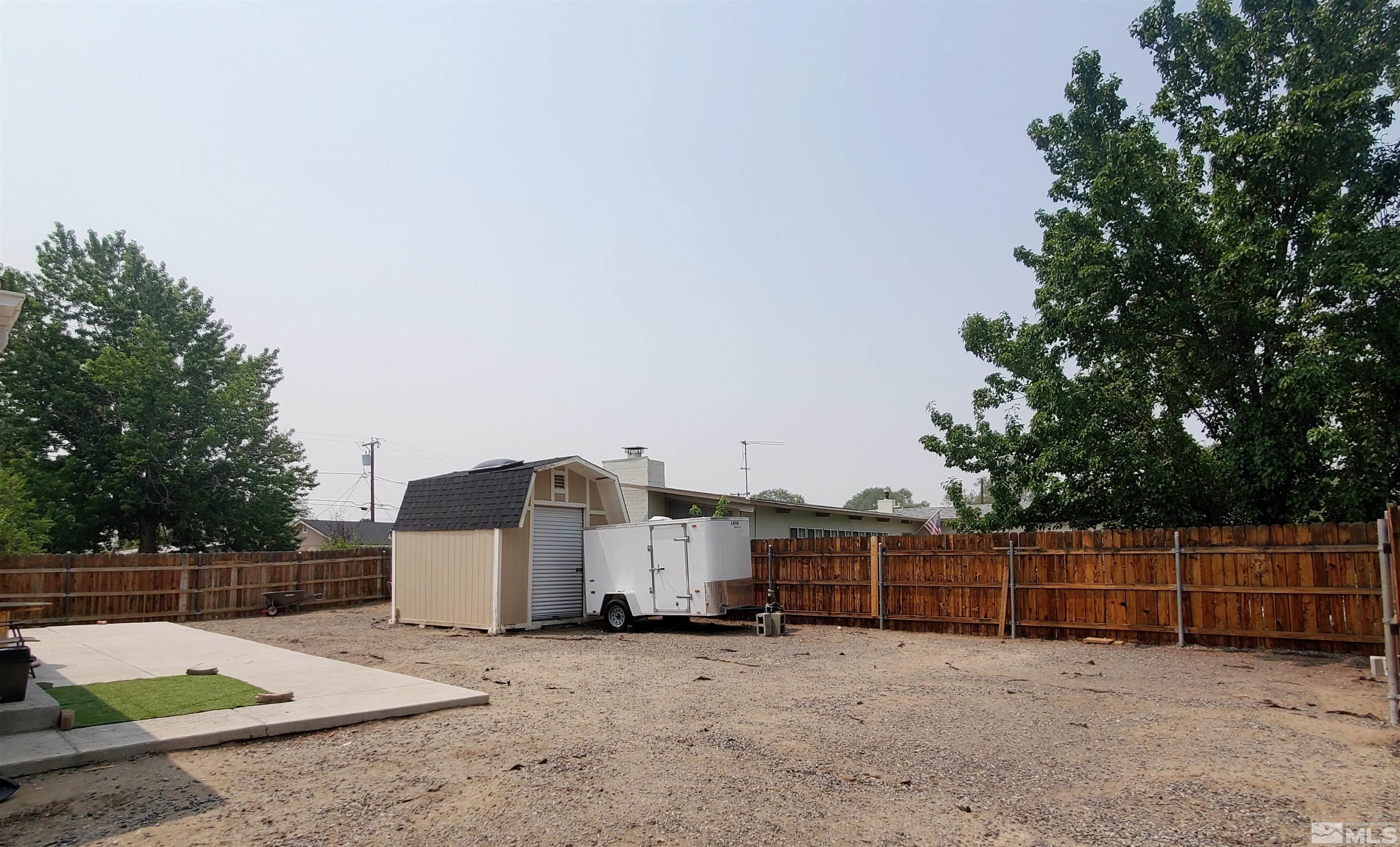 13590 Mt Olympus Street Reno, NV 89506 - Photo 14 of 17 a view of a truck parked in a backyard