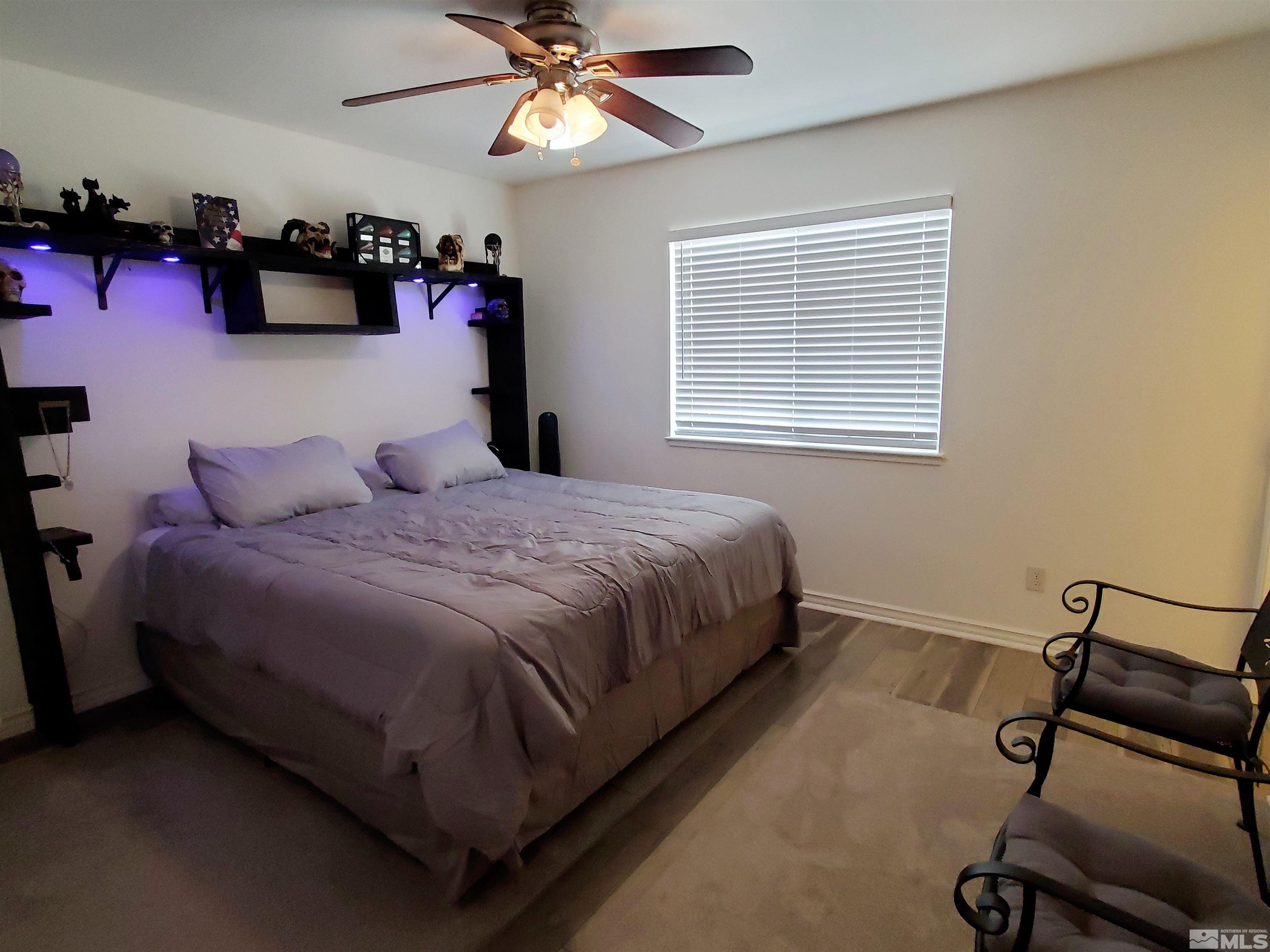 13590 Mt Olympus Street Reno, NV 89506 - Photo 6 of 17 a bedroom with a bed furniture and a window