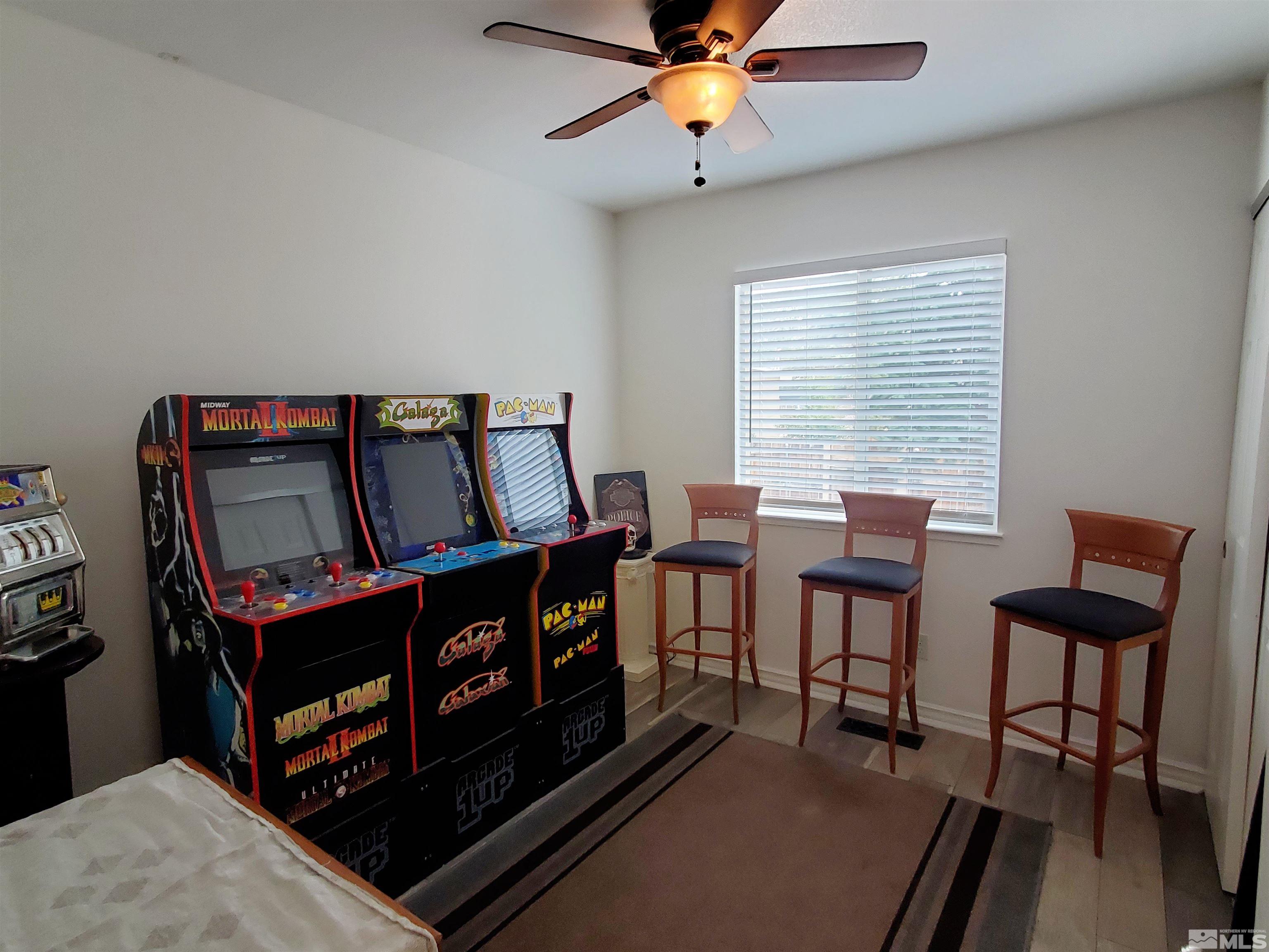 13590 Mt Olympus Street Reno, NV 89506 - Photo 7 of 17 a bedroom with furniture and a window