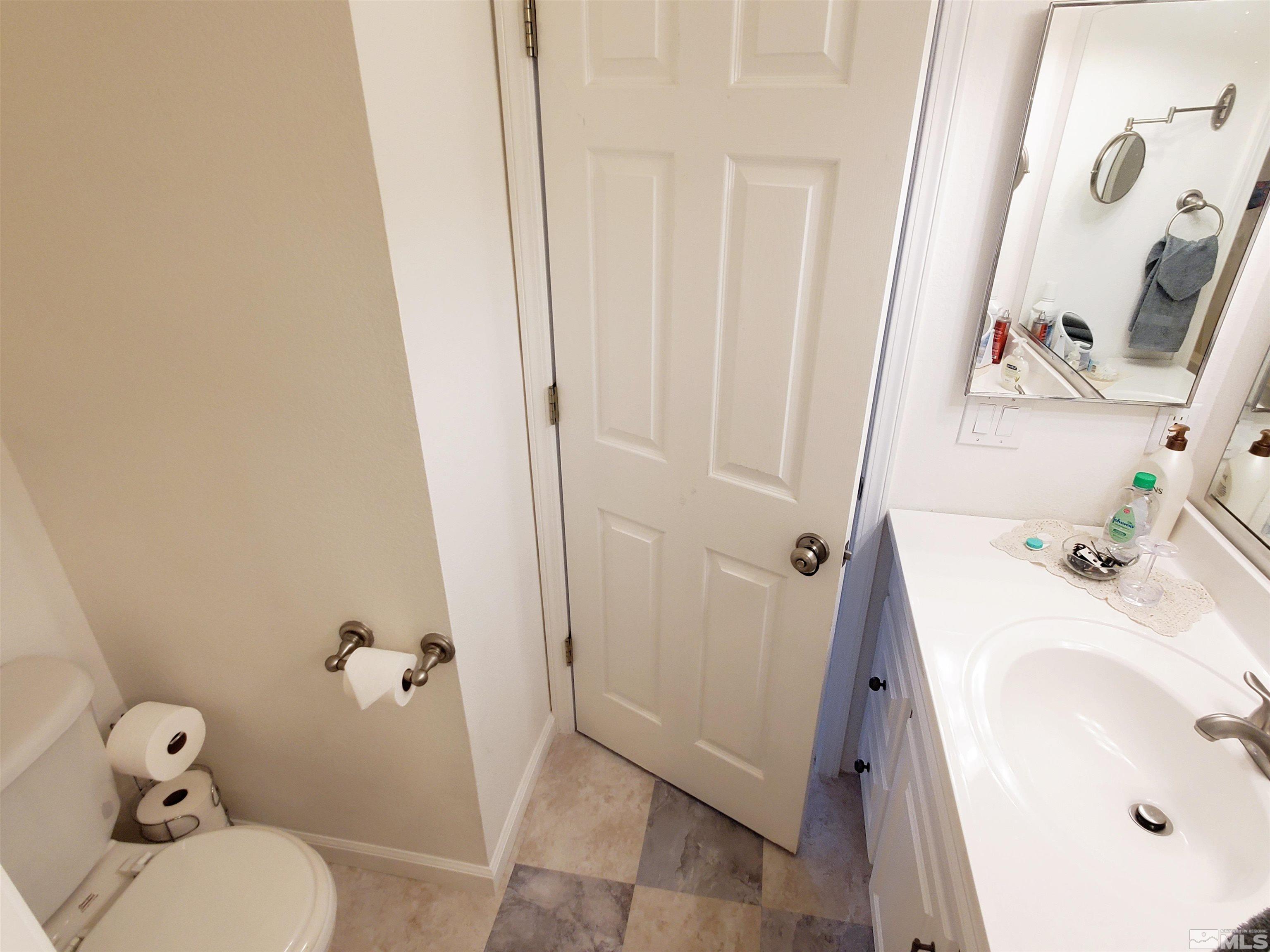 13590 Mt Olympus Street Reno, NV 89506 - Photo 10 of 17 a bathroom with a sink and toilet