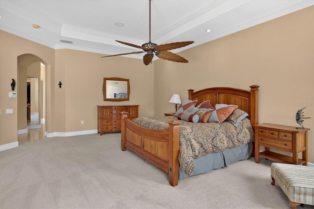 9427 Eddings Road Odessa, FL 33556 - Photo 36 of 93 a bedroom with a bed a dresser and window