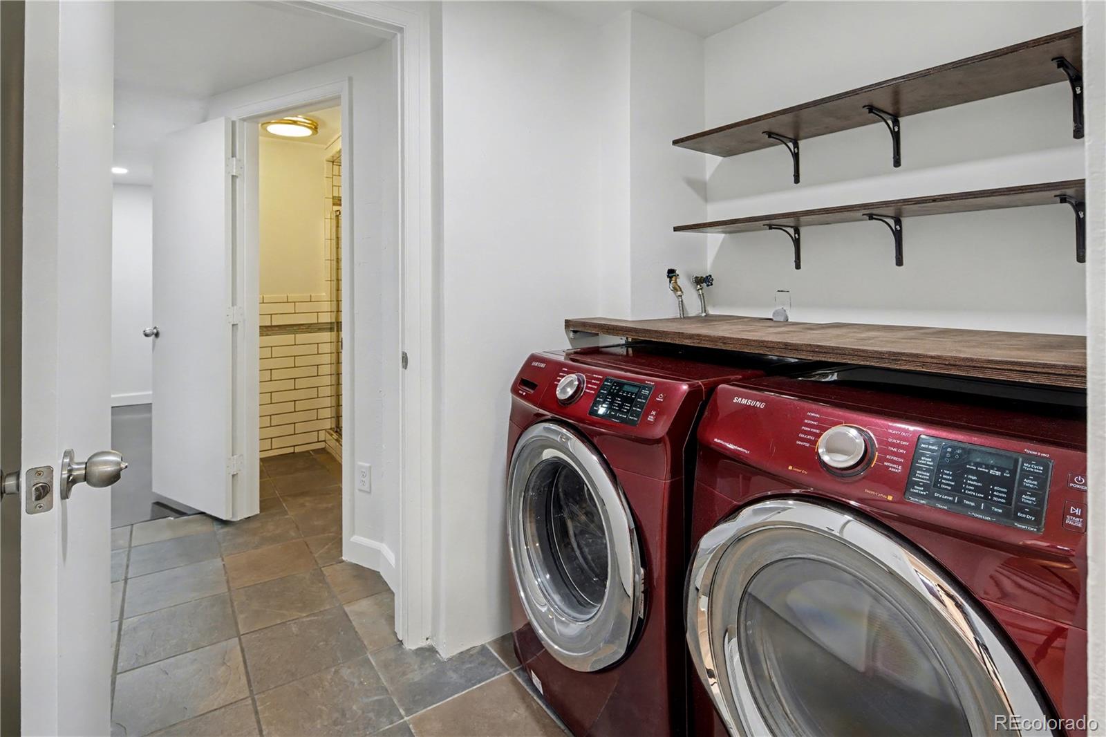 9142 Oberon Road Arvada, CO 80004 - Photo 21 of 35 a utility room with dryer and washer