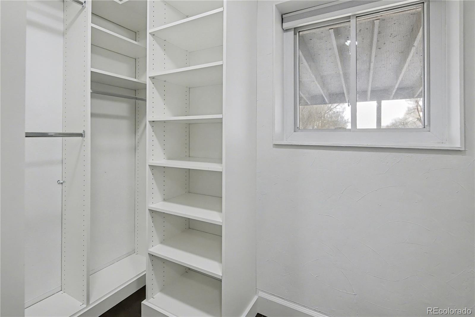 9142 Oberon Road Arvada, CO 80004 - Photo 25 of 35 a view of an empty walk in closet