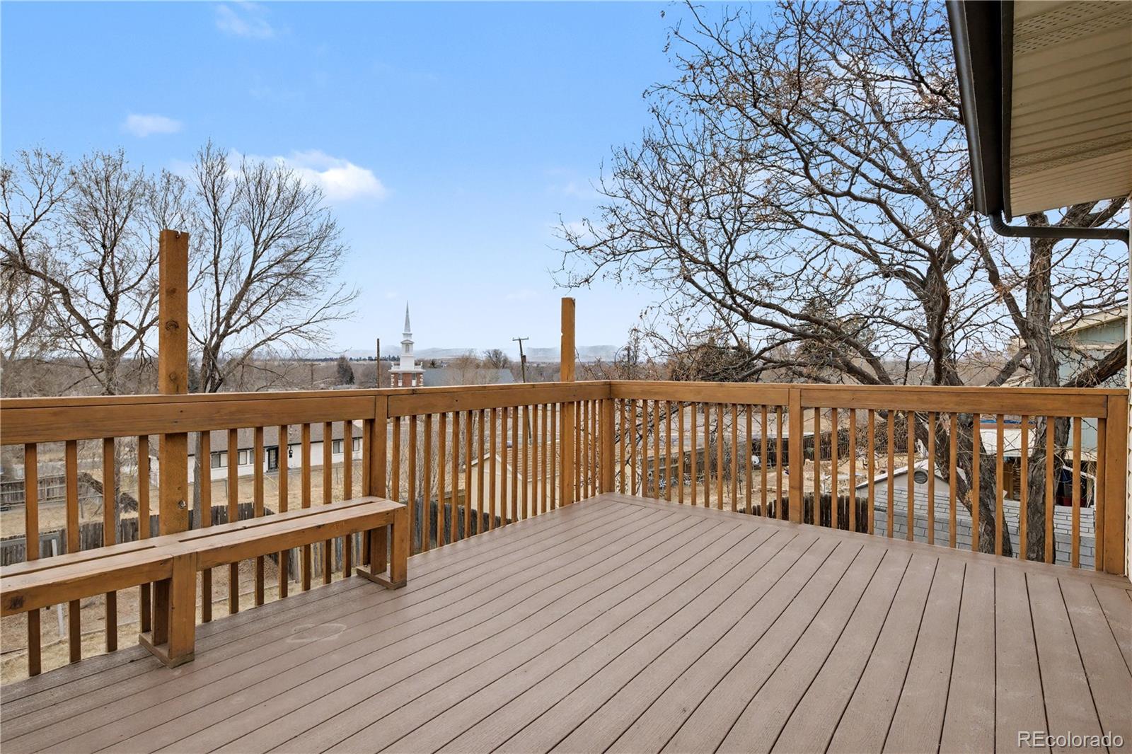 9142 Oberon Road Arvada, CO 80004 - Photo 27 of 35 a balcony with wooden floor and fence
