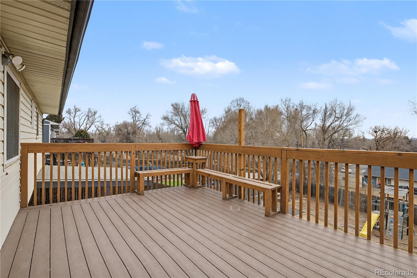 9142 Oberon Road Arvada, CO 80004 - Photo 29 of 35 a view of balcony with wooden floor and fence