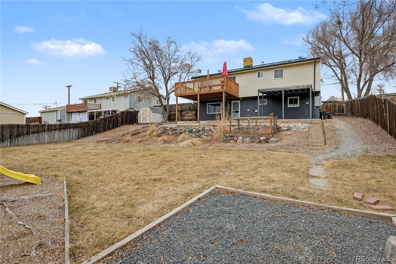 9142 Oberon Road Arvada, CO 80004 - Photo 30 of 35 a view of a house with snow