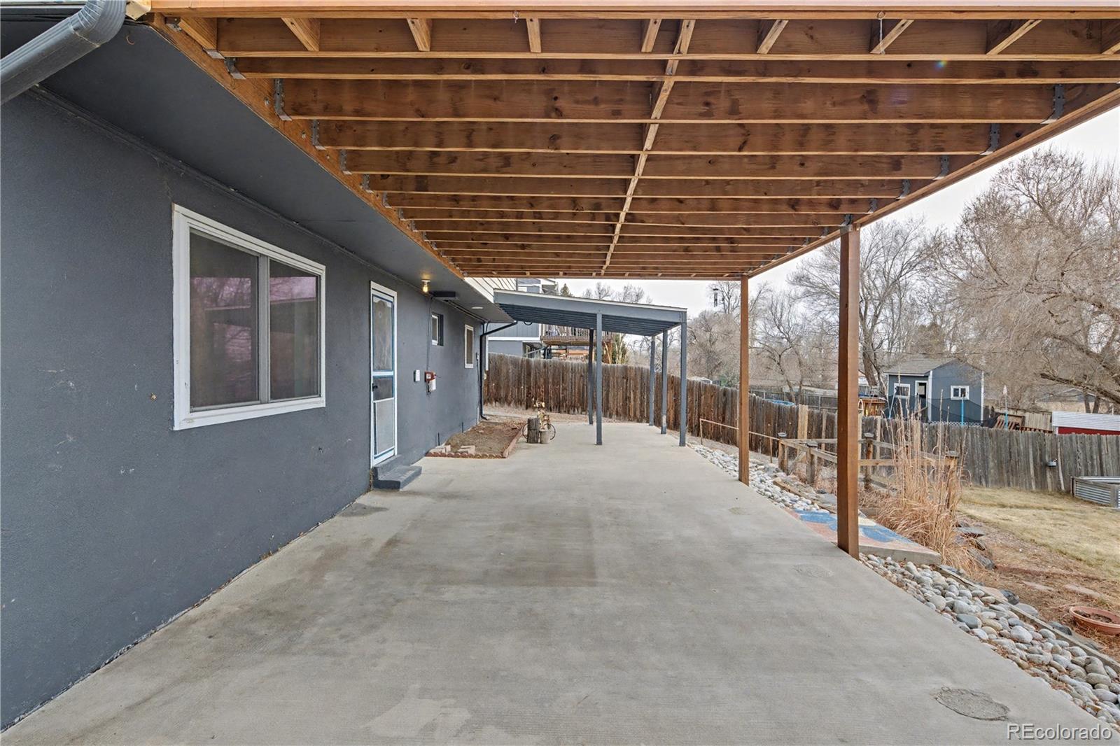 9142 Oberon Road Arvada, CO 80004 - Photo 33 of 35 a view of porch with seating space