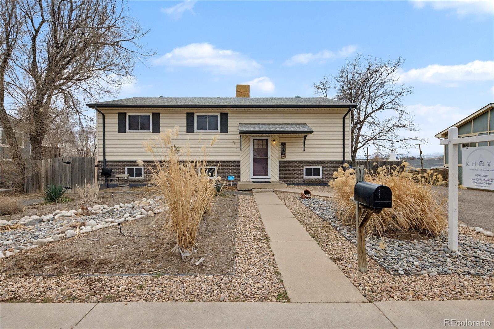 9142 Oberon Road Arvada, CO 80004 - Photo 34 of 35 a front view of a house with garden