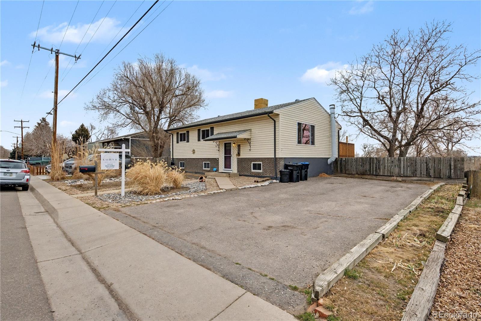 9142 Oberon Road Arvada, CO 80004 - Photo 35 of 35 a view of a house with a yard covered in snow