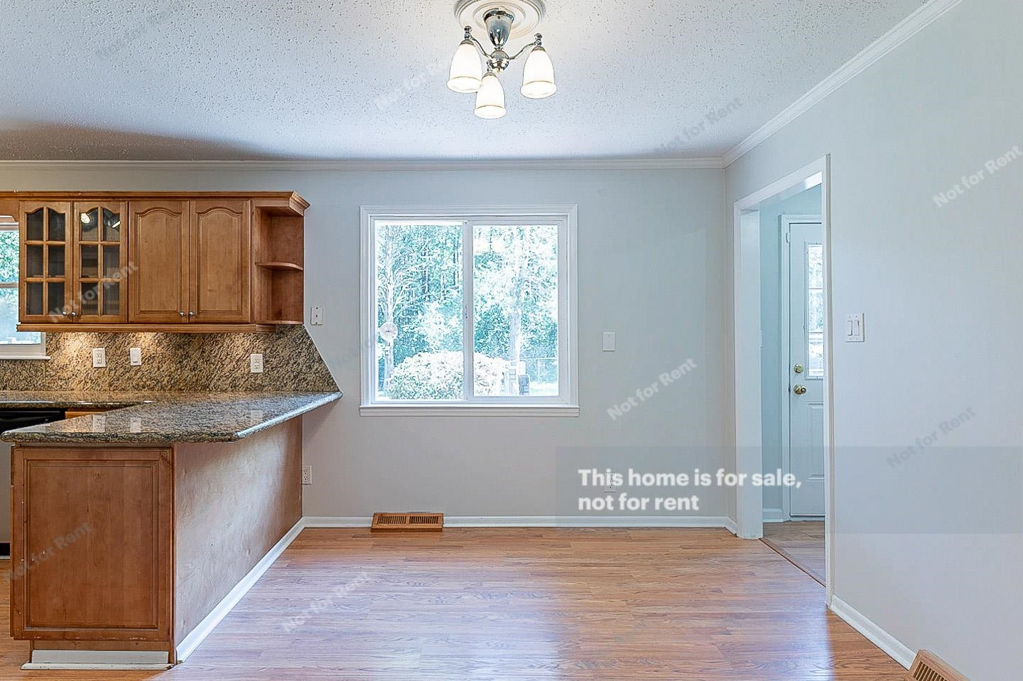 2612 Joyner Road Durham, NC 27704 - Photo 11 of 25 an empty room with wooden floor and a window