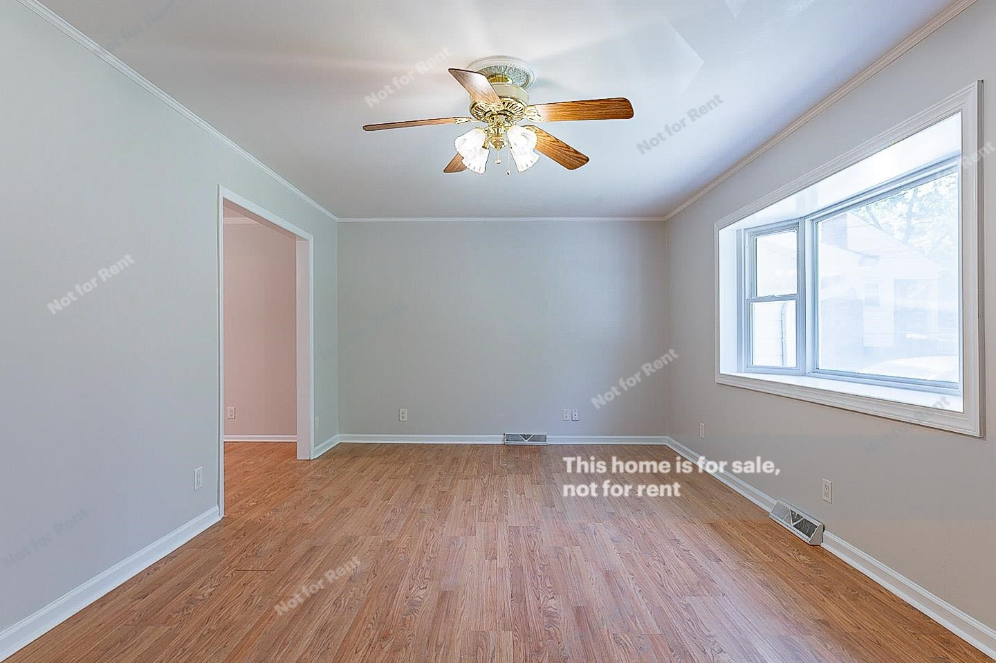 2612 Joyner Road Durham, NC 27704 - Photo 13 of 25 an empty room with wooden floor and windows