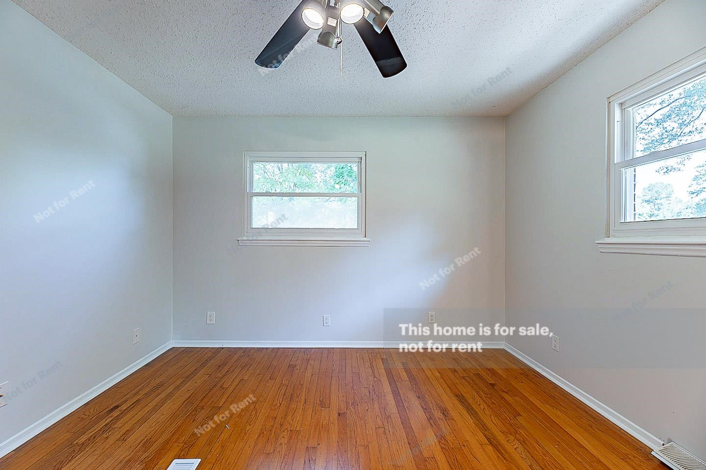 2612 Joyner Road Durham, NC 27704 - Photo 14 of 25 a view of empty room with wooden floor and window