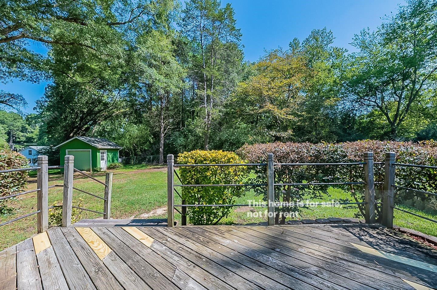 2612 Joyner Road Durham, NC 27704 - Photo 23 of 25 a view of a backyard with wooden floor and outdoor seating