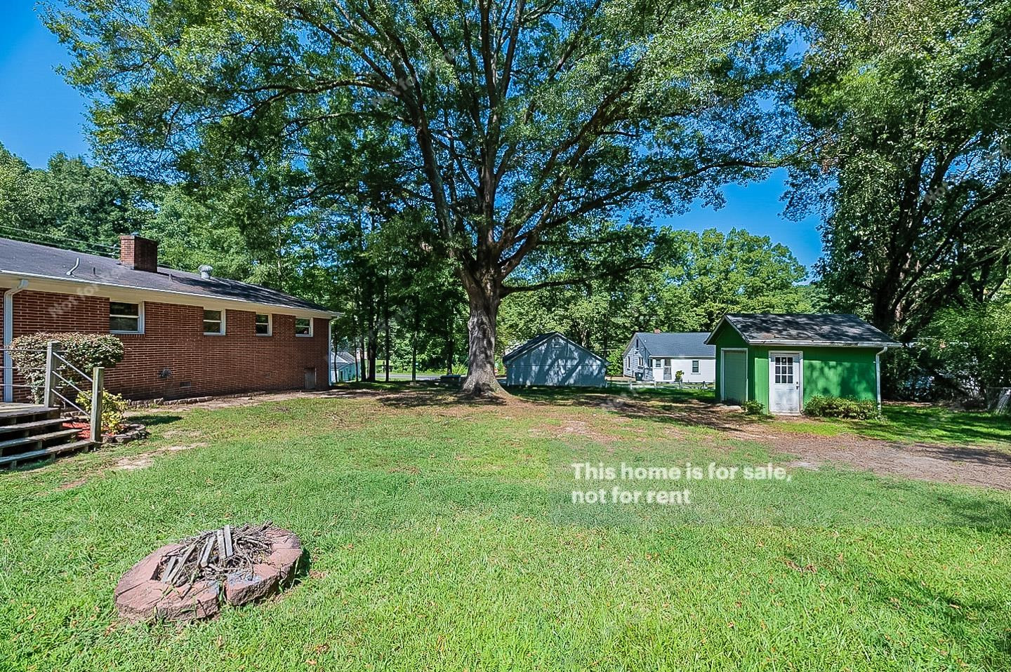 2612 Joyner Road Durham, NC 27704 - Photo 25 of 25 a view of a backyard with a garden and trees