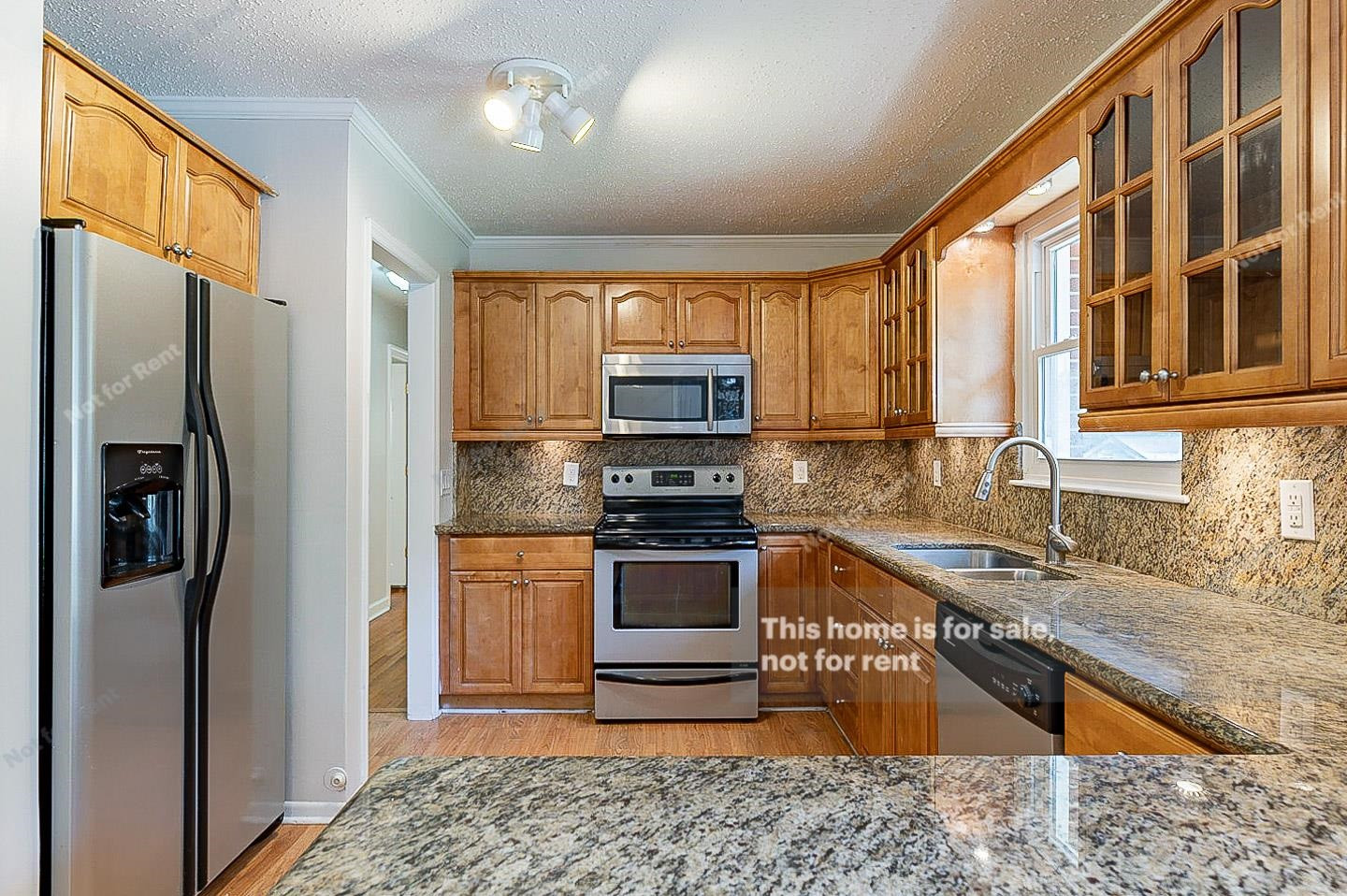 2612 Joyner Road Durham, NC 27704 - Photo 6 of 25 a kitchen with stainless steel appliances granite countertop a refrigerator stove and sink