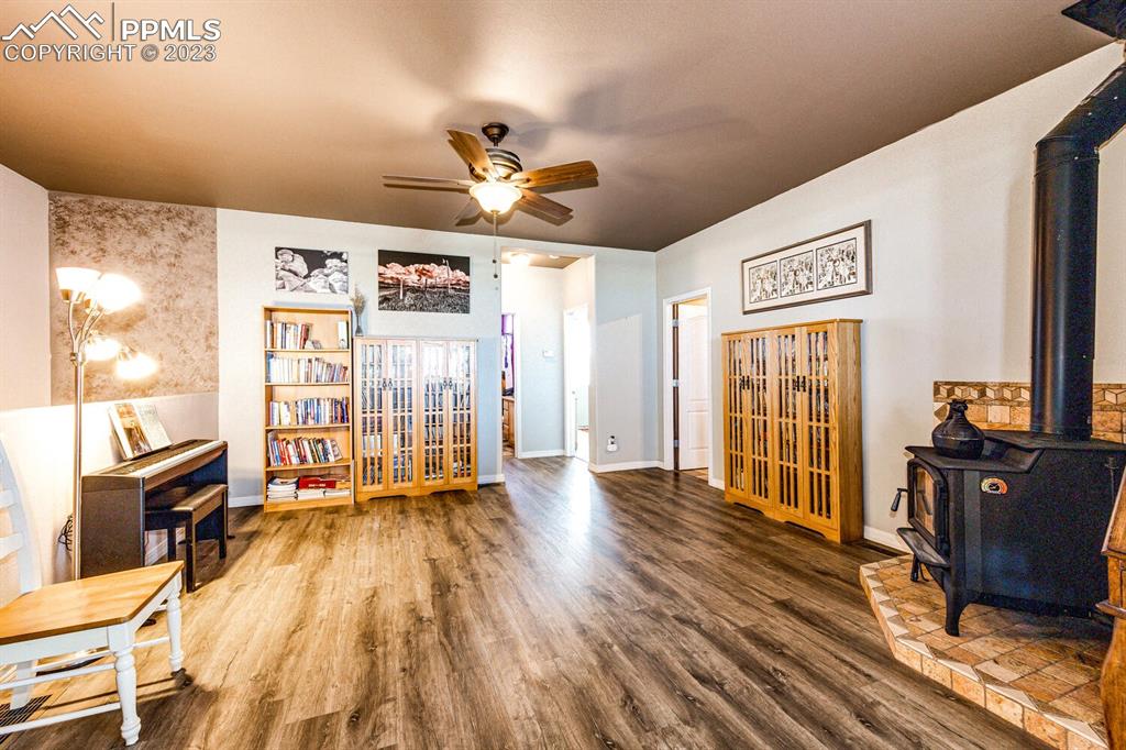 4685 County Road 106 Elbert, CO 80106 - Photo 16 of 43 a view of a livingroom with furniture a ceiling fan and wooden floor