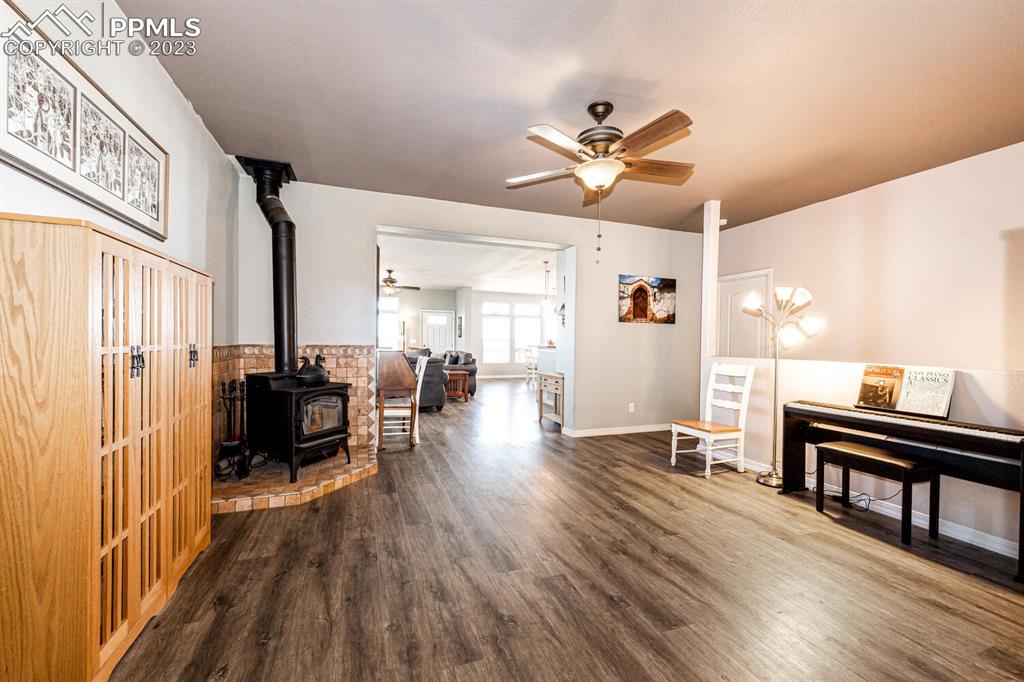4685 County Road 106 Elbert, CO 80106 - Photo 17 of 43 a view of a livingroom with furniture a ceiling fan and wooden floor