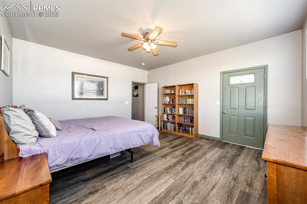 4685 County Road 106 Elbert, CO 80106 - Photo 19 of 43 a bedroom with a bed and a cabinets