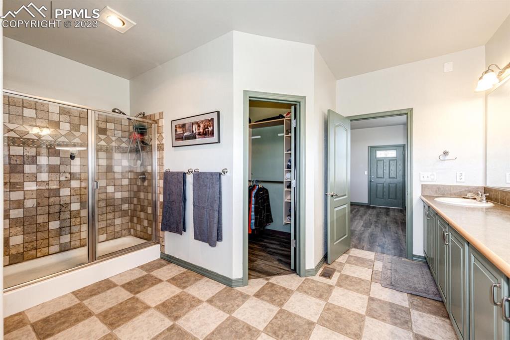 4685 County Road 106 Elbert, CO 80106 - Photo 21 of 43 a view of a bathroom with a tub shower and bathroom