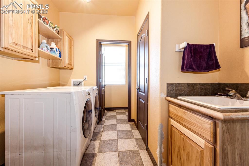 4685 County Road 106 Elbert, CO 80106 - Photo 24 of 43 a utility room with dryer and washer
