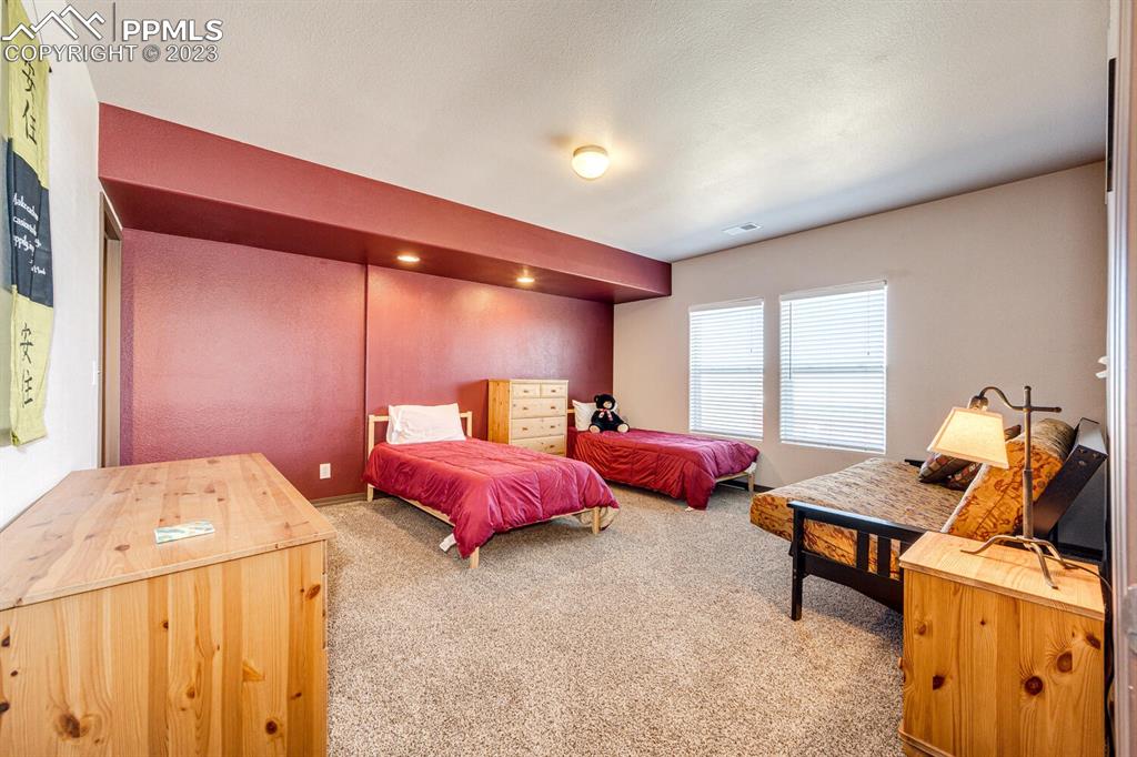 4685 County Road 106 Elbert, CO 80106 - Photo 31 of 43 a bedroom with furniture and a bed