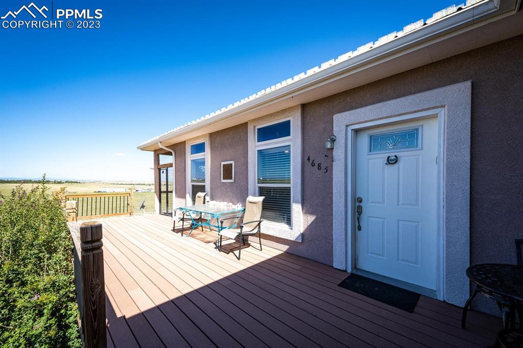 4685 County Road 106 Elbert, CO 80106 - Photo 7 of 43 a view of a balcony with chair and wooden floor