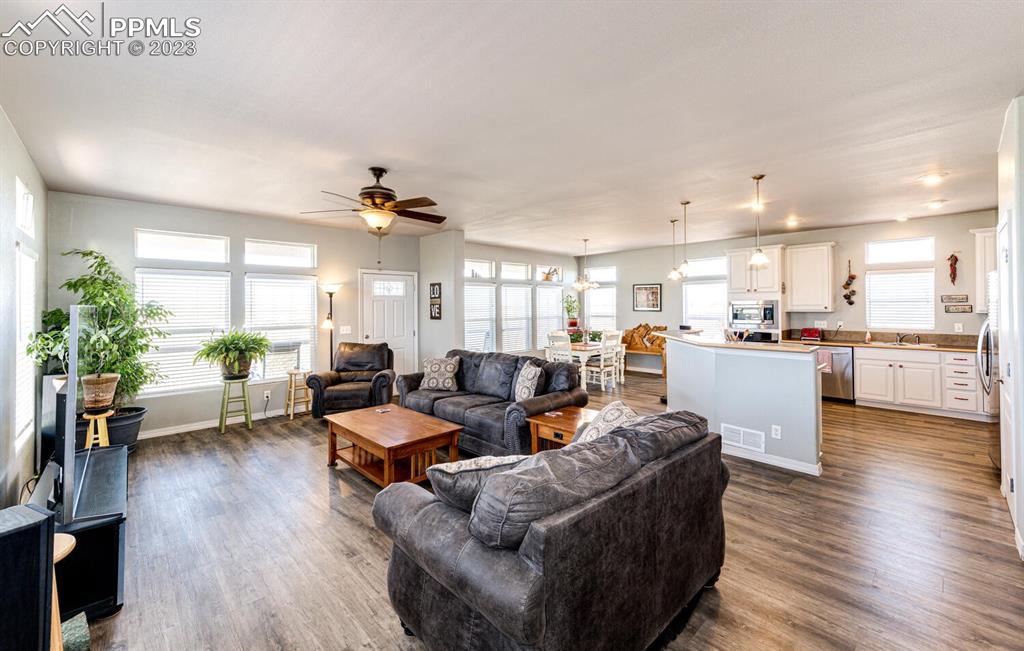 4685 County Road 106 Elbert, CO 80106 - Photo 9 of 43 a living room with furniture and kitchen view